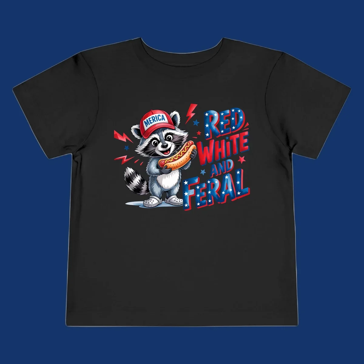 A cartoon raccoon wearing a 'MERICA' hat and holding a hot dog, next to text 'RED WHITE AND FERAL'. This is a raccoon-red-white-feral design.