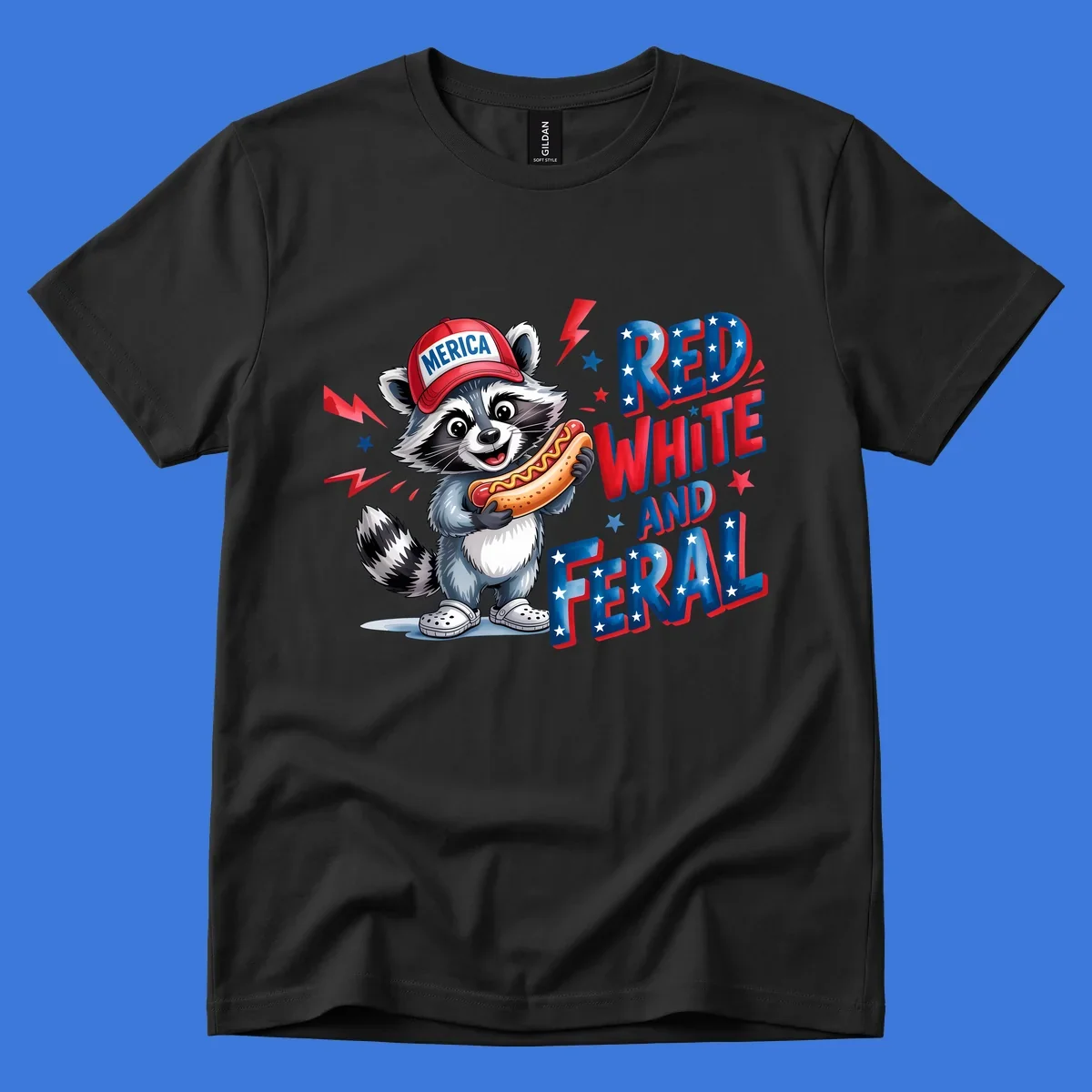 A cartoon raccoon wearing a 'MERICA' hat and holding a hot dog, next to text 'RED WHITE AND FERAL'. This is a raccoon-red-white-feral design.