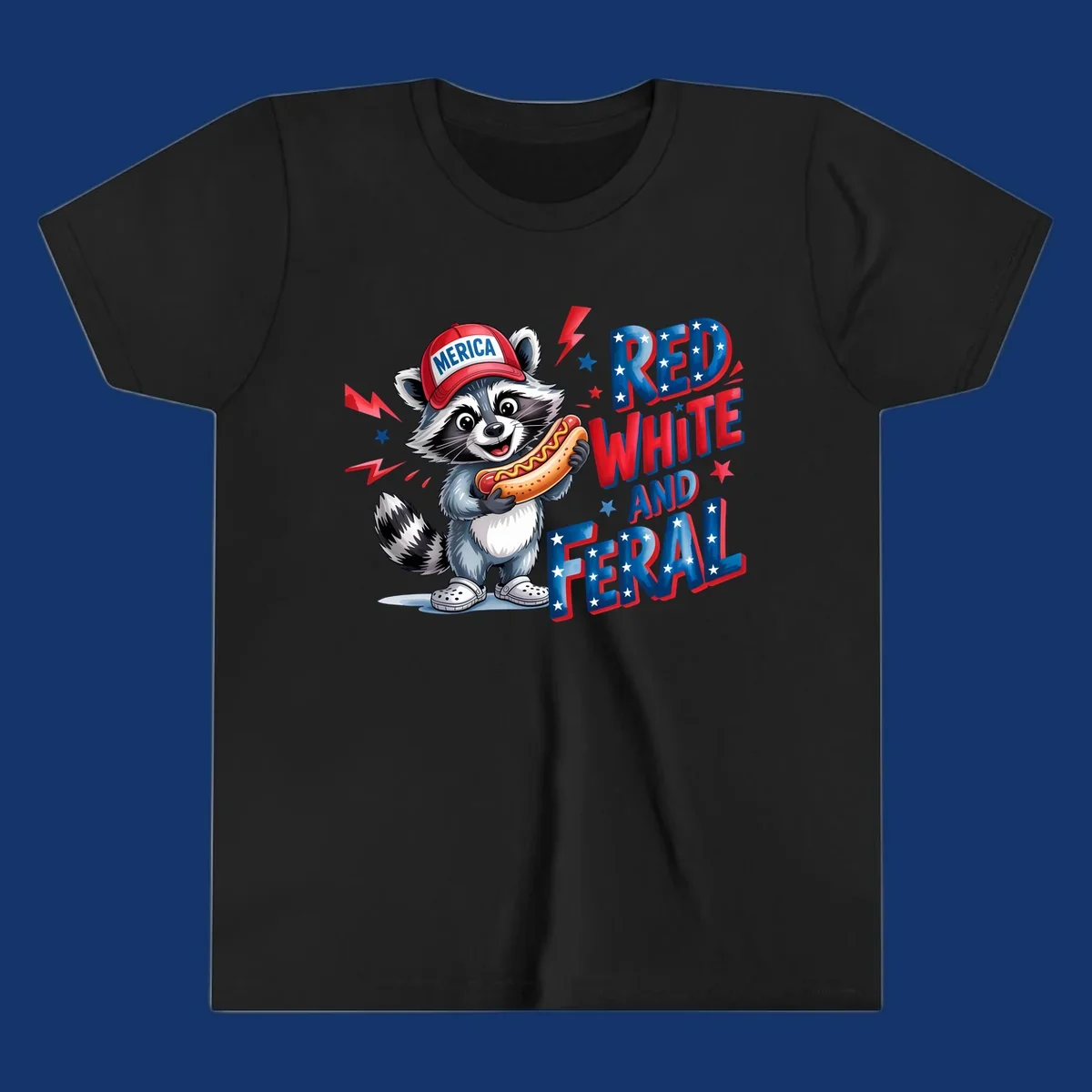 A cartoon raccoon wearing a 'MERICA' hat and holding a hot dog, next to text 'RED WHITE AND FERAL'. This is a raccoon-red-white-feral design.
