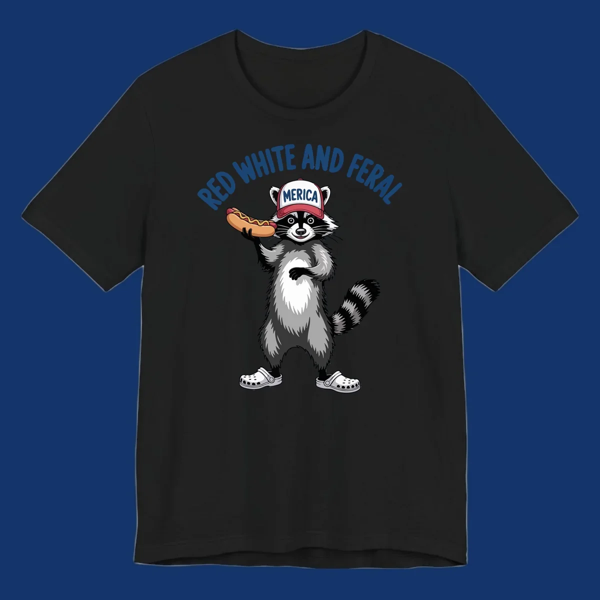 A patriotic raccoon in a MERICA hat and Crocs holds a hot dog, with 'RED WHITE AND FERAL' text. Features the red-white-feral-raccoon concept.