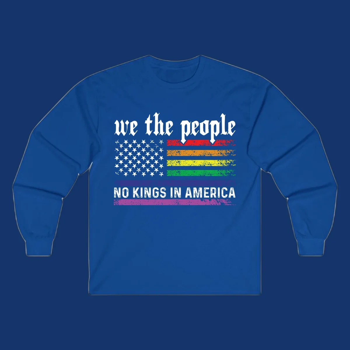 A distressed American flag with rainbow stripes and white stars, featuring 'we the people' and 'NO KINGS IN AMERICA' text.