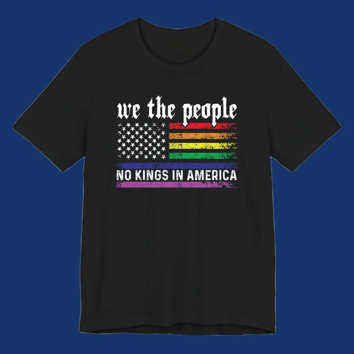A distressed American flag with rainbow stripes and white stars, featuring 'we the people' and 'NO KINGS IN AMERICA' text.