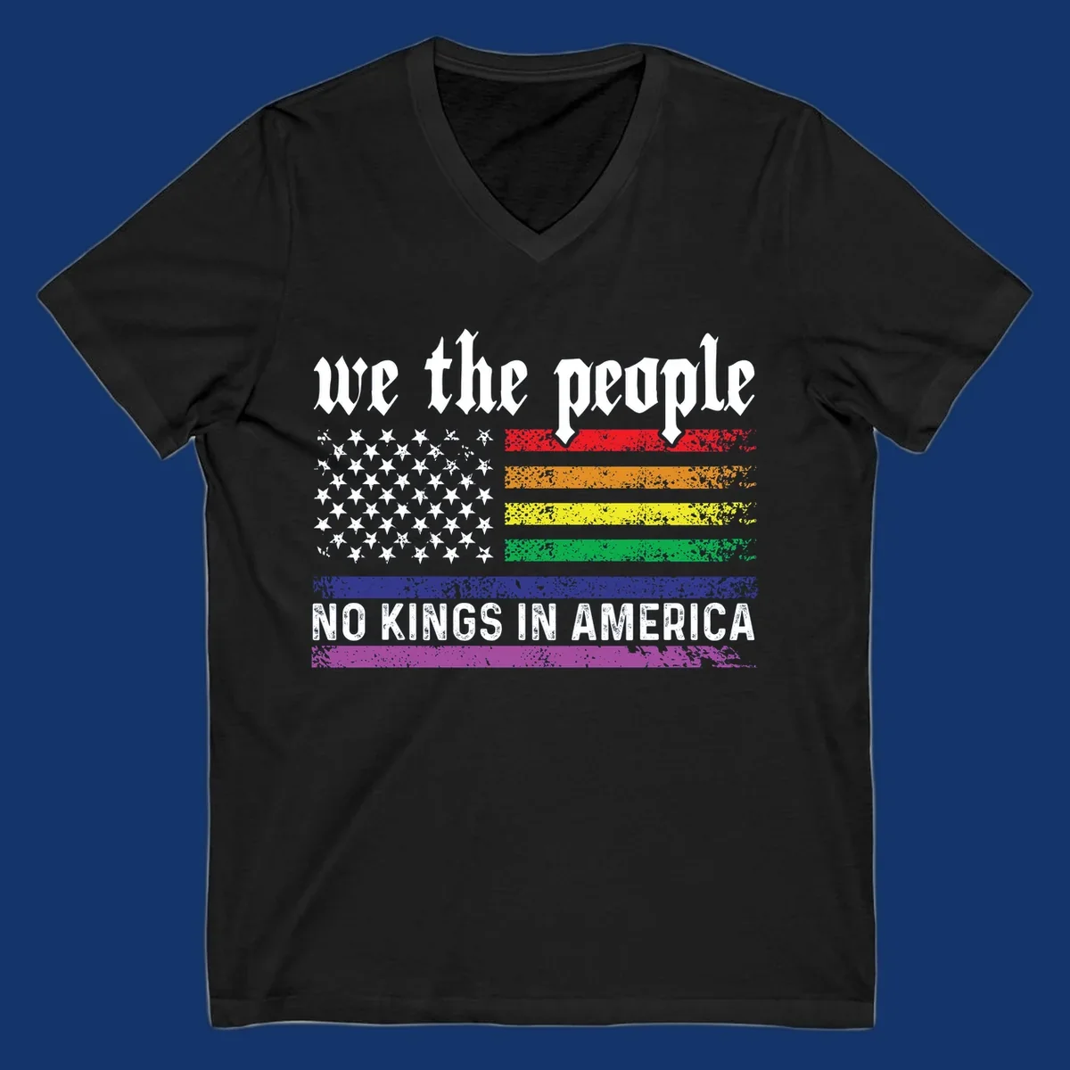 A distressed American flag with rainbow stripes and white stars, featuring 'we the people' and 'NO KINGS IN AMERICA' text.