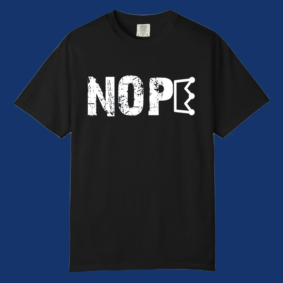 A distressed 'NOPE' text design where the 'E' is a crown outline, clean on all garment colors.