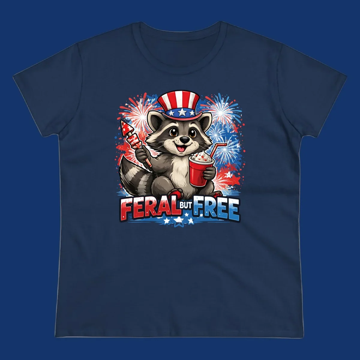 A cartoon raccoon in an Uncle Sam hat holds a firework and drink, with red, white, and blue fireworks and "FERAL BUT FREE" text.