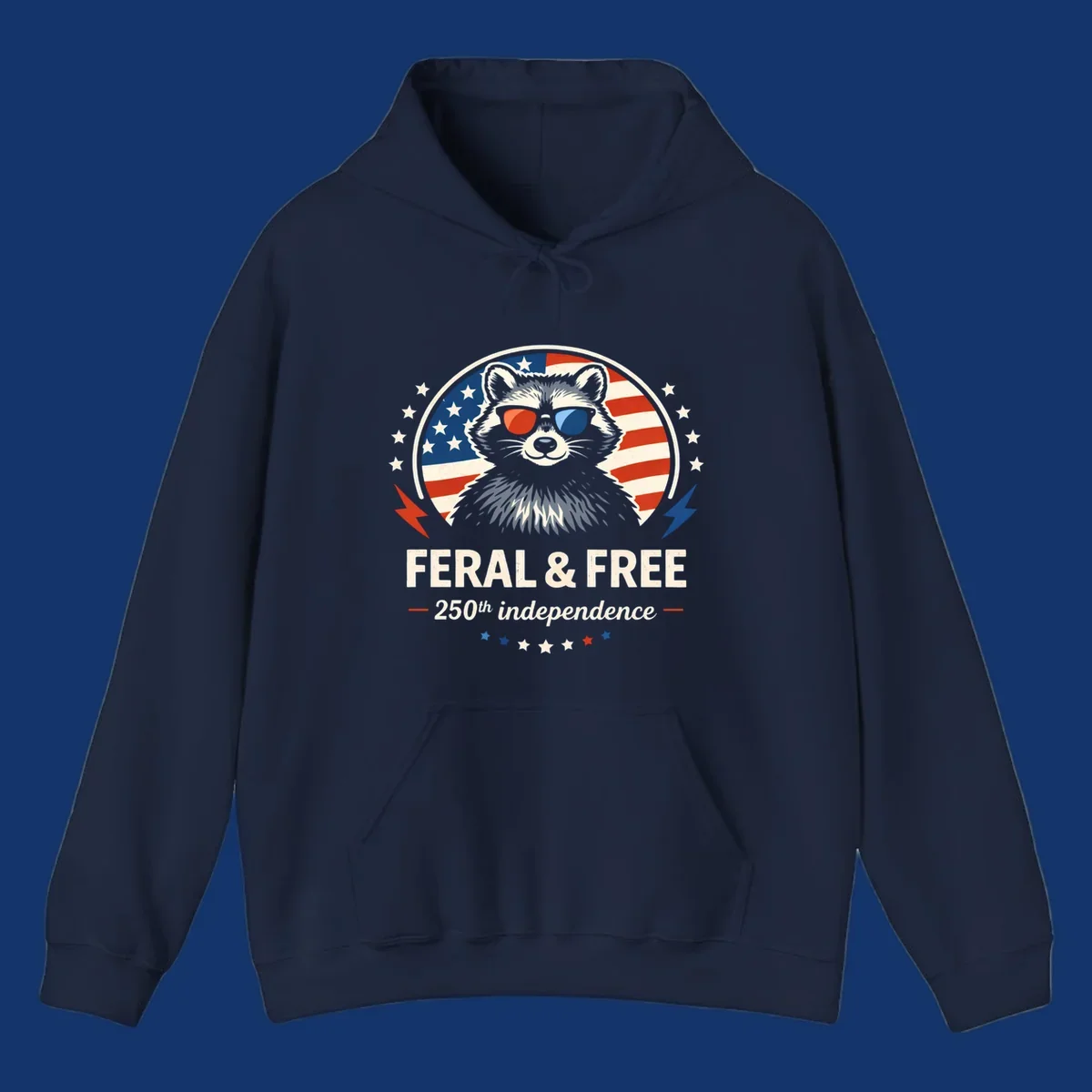 A patriotic design with a raccoon in red and blue sunglasses against an American flag, with text 'Feral & Free 250th Independence'.