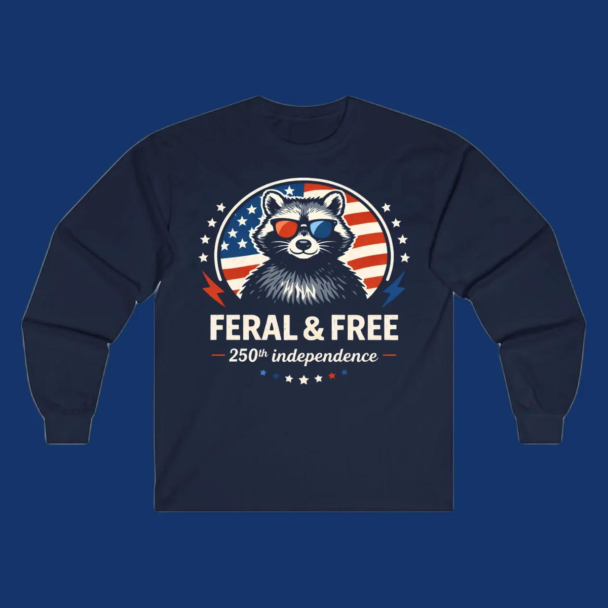 A patriotic design with a raccoon in red and blue sunglasses against an American flag, with text 'Feral & Free 250th Independence'.