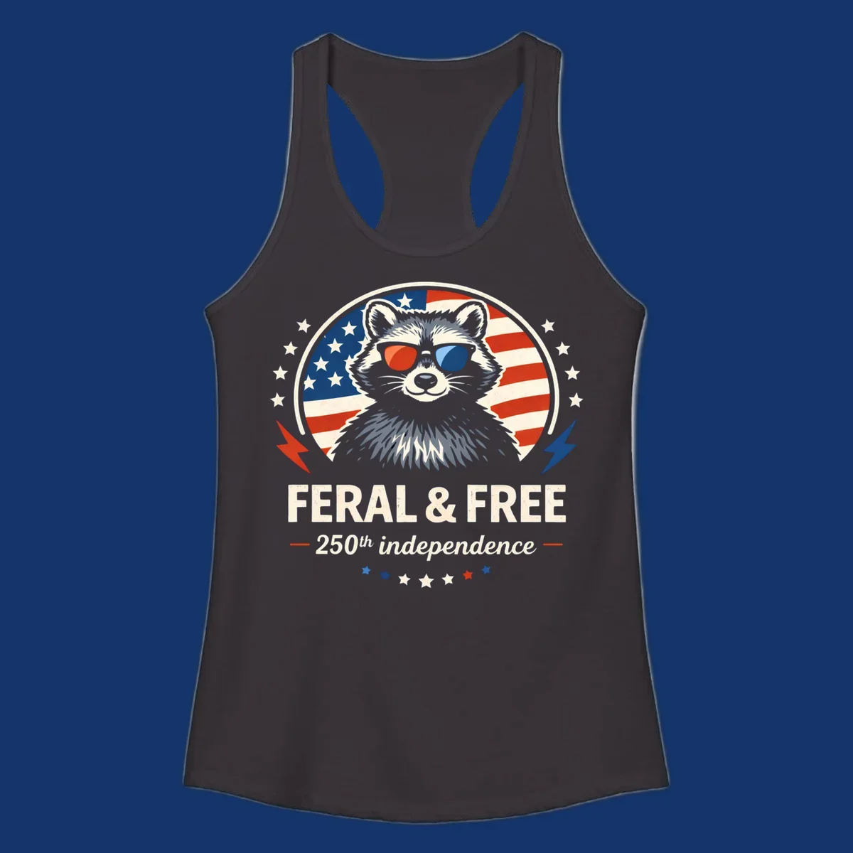 A patriotic design with a raccoon in red and blue sunglasses against an American flag, with text 'Feral & Free 250th Independence'.