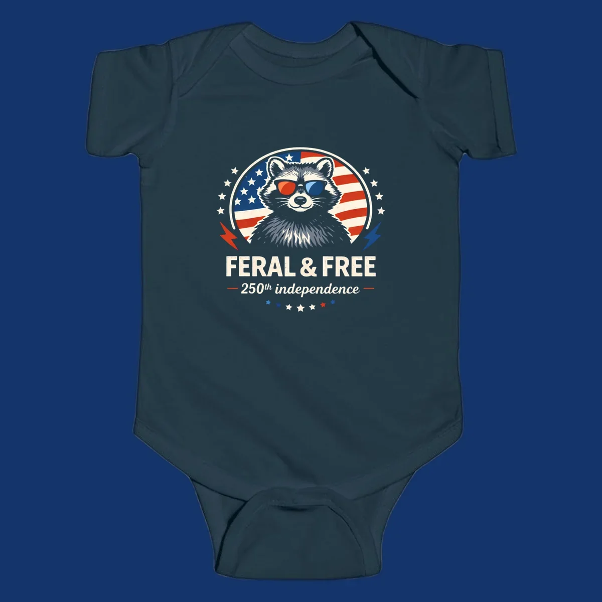 A patriotic design with a raccoon in red and blue sunglasses against an American flag, with text 'Feral & Free 250th Independence'.