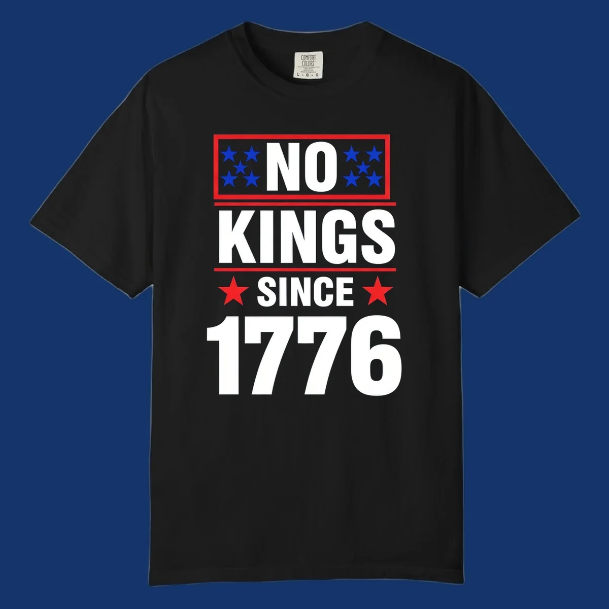 A patriotic design with the text 'NO KINGS SINCE 1776' in white and navy, featuring blue and red stars.