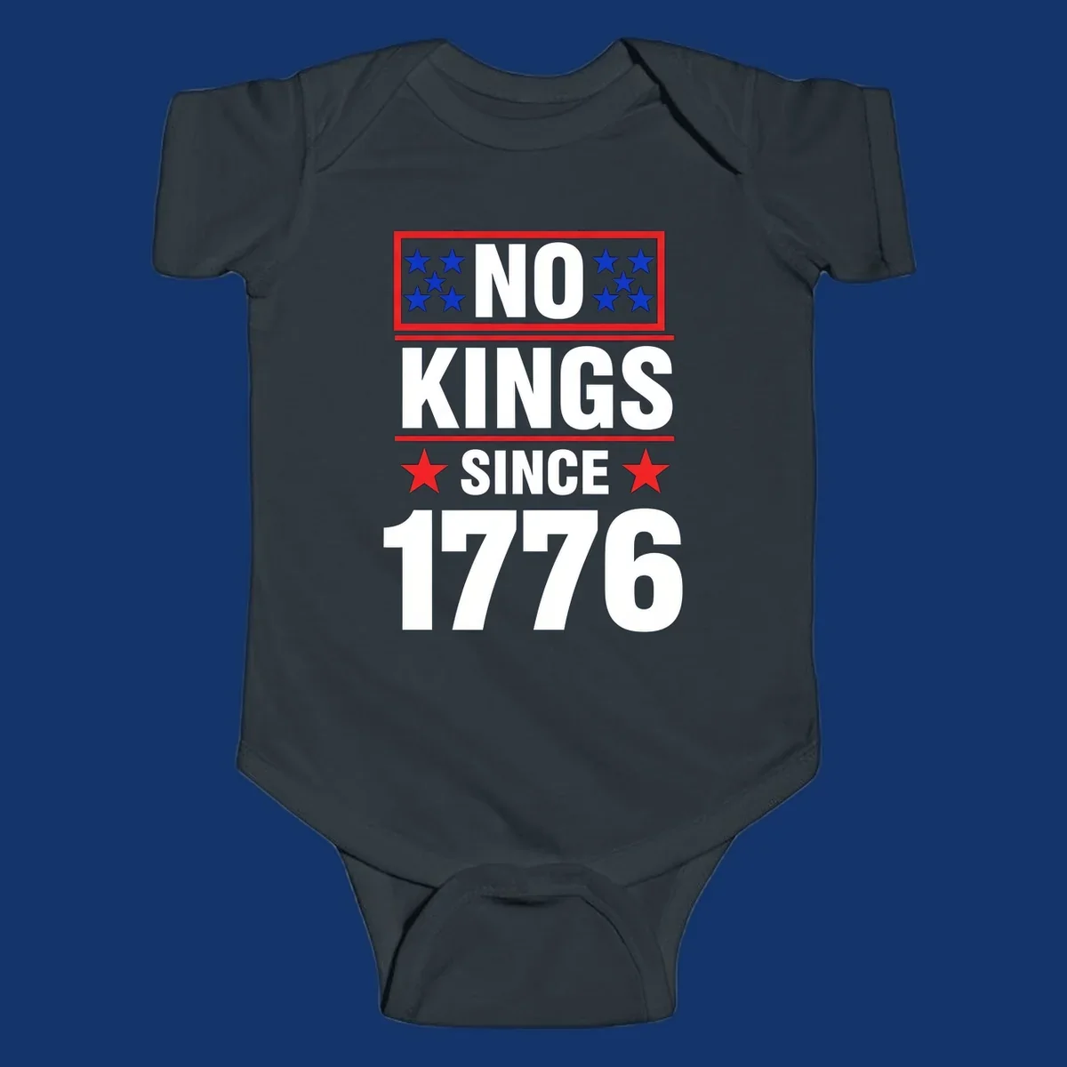 A patriotic design with the text 'NO KINGS SINCE 1776' in white and navy, featuring blue and red stars.