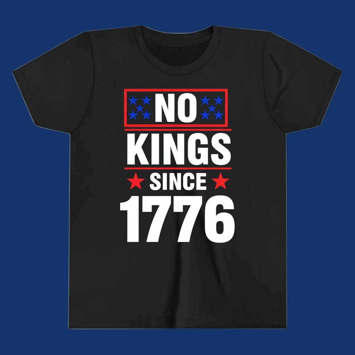 A patriotic design with the text 'NO KINGS SINCE 1776' in white and navy, featuring blue and red stars.