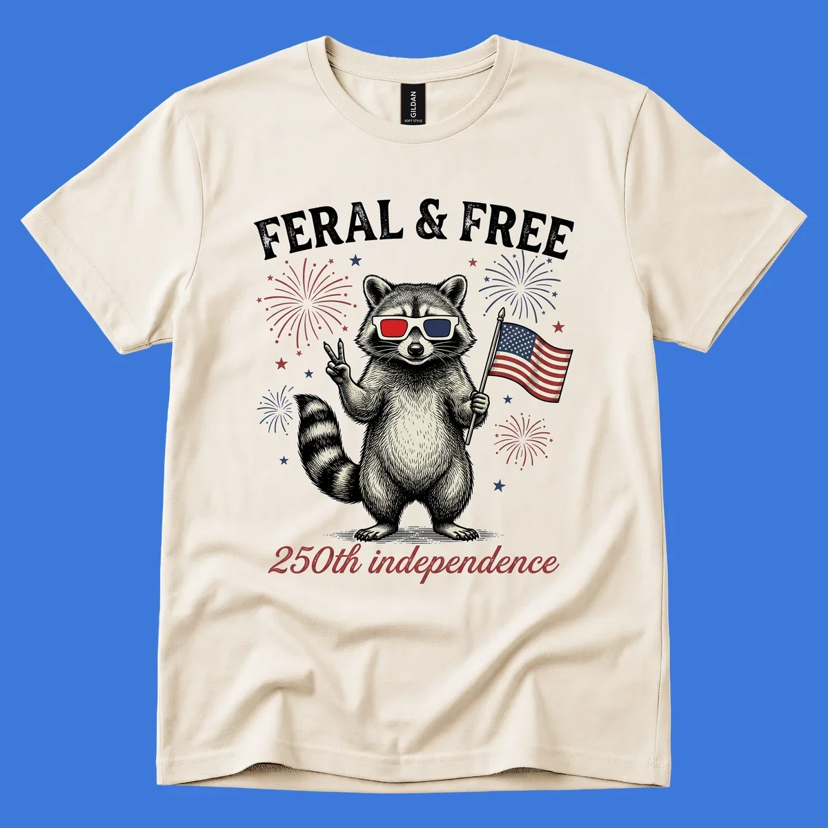 An illustrated raccoon in 3D glasses with an American flag and fireworks, text says 'Feral & Free 250th independence'.