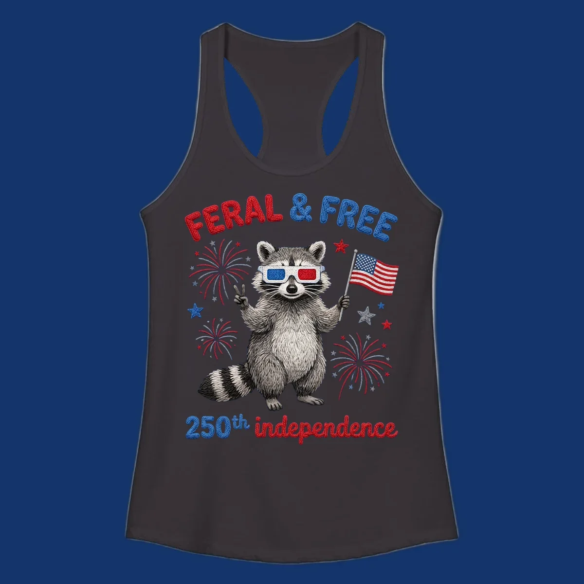 A playful raccoon in 3D glasses holds an American flag, surrounded by fireworks and stars, with "FERAL & FREE 250th independence".