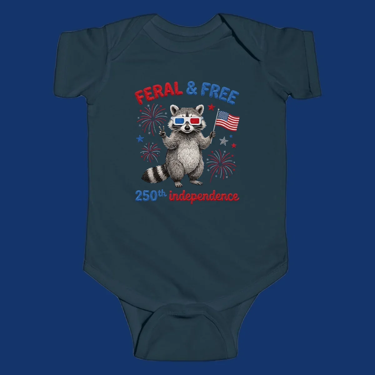A playful raccoon in 3D glasses holds an American flag, surrounded by fireworks and stars, with "FERAL & FREE 250th independence".