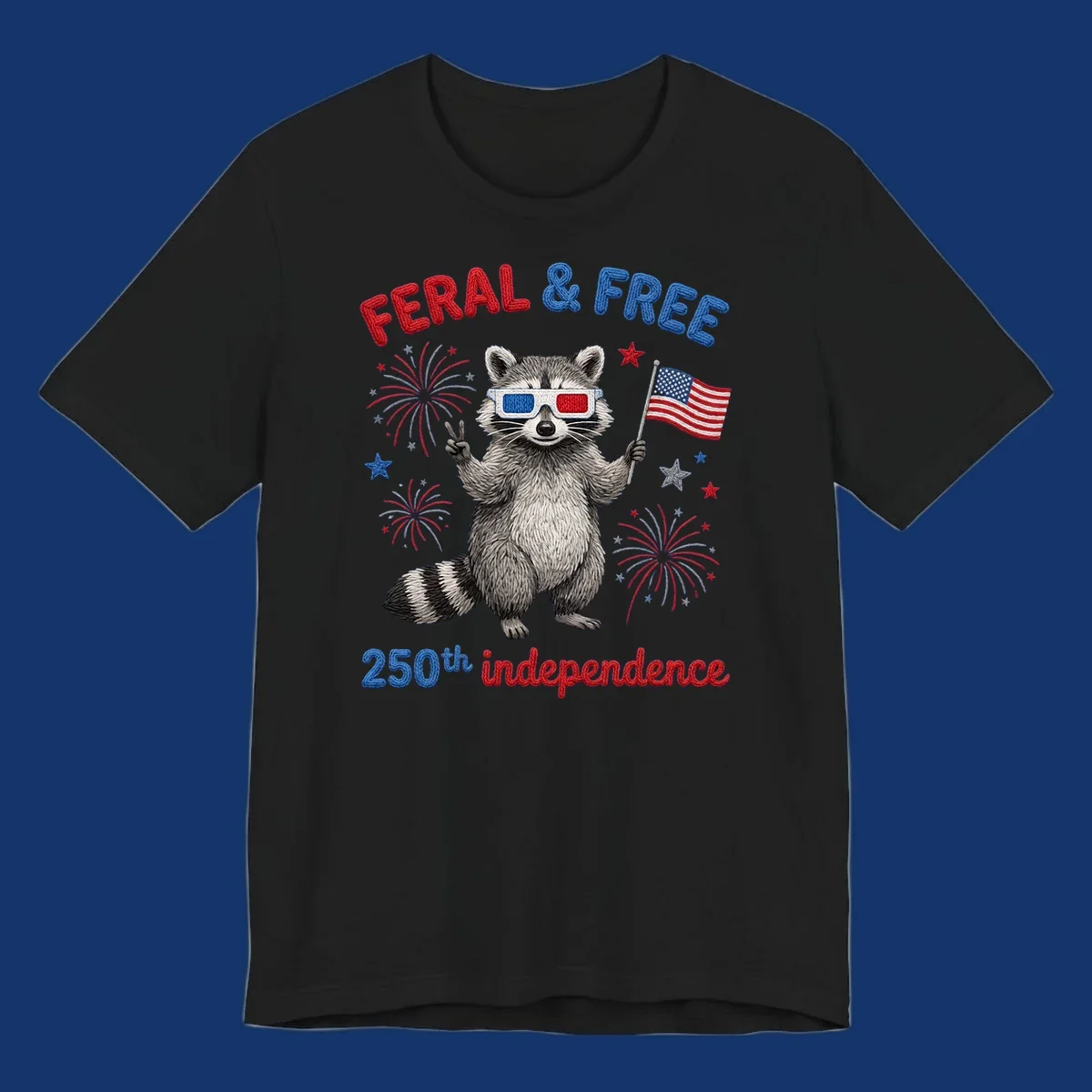 A "FERAL & FREE" raccoon in 3D glasses holds an American flag, surrounded by fireworks, celebrating 250th independence.