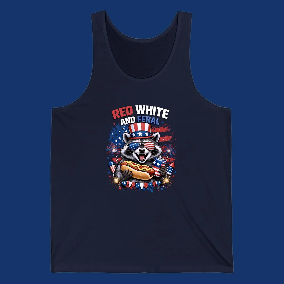 A patriotic raccoon wearing an American flag top hat and sunglasses, holding a hot dog and soda can, with the text 'RED WHITE AND FERAL' and fireworks.