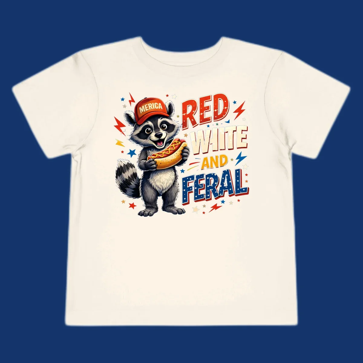 A happy raccoon in a 'MERICA' hat holds a hot dog, with 'RED WHITE AND FERAL' text, stars, and lightning bolts. Features a raccoon-merica-feral-hotdog theme.