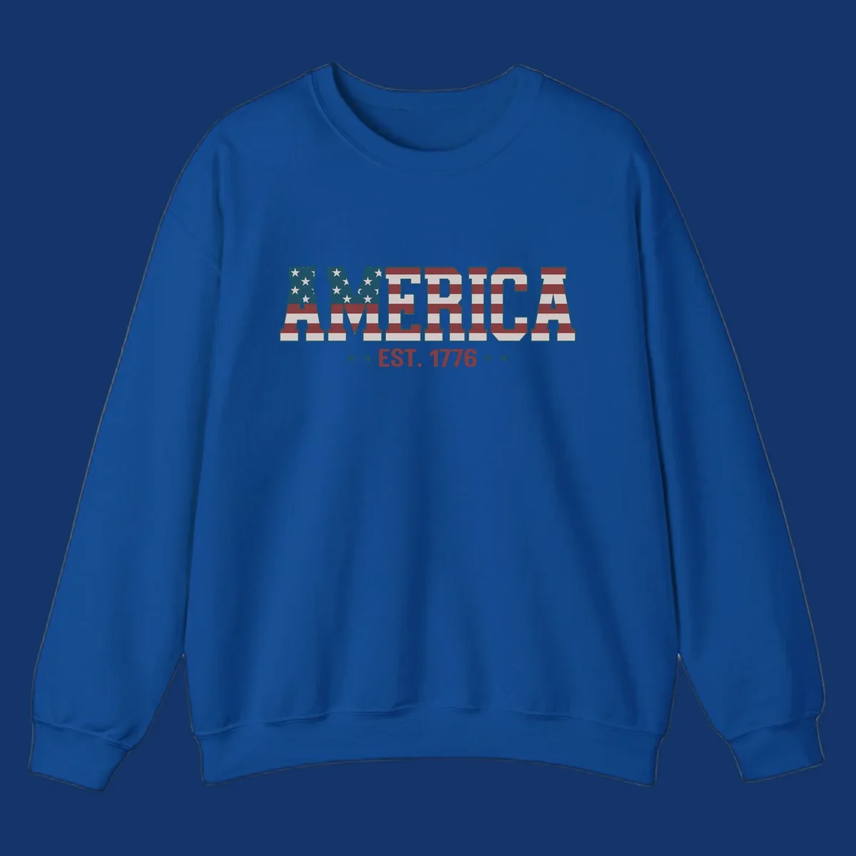 The word AMERICA in block letters, filled with an American flag pattern, above the text EST. 1776 with stars. Concept: america-est-1776-flag.
