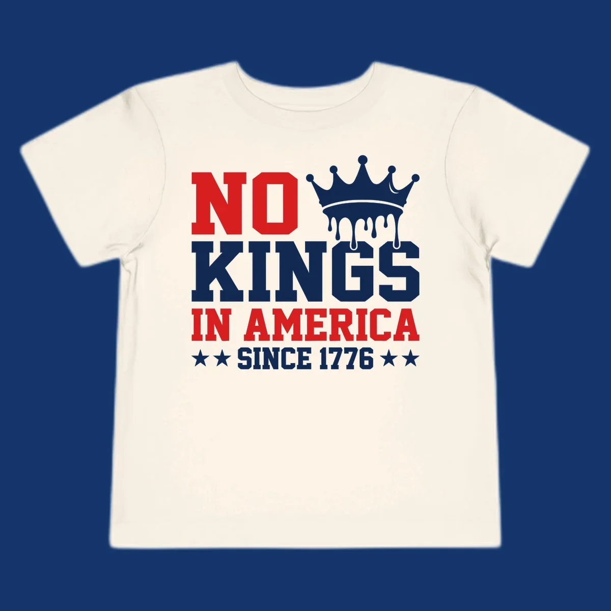 A patriotic design with text "NO KINGS IN AMERICA SINCE 1776" and a dripping blue crown, celebrating American independence.