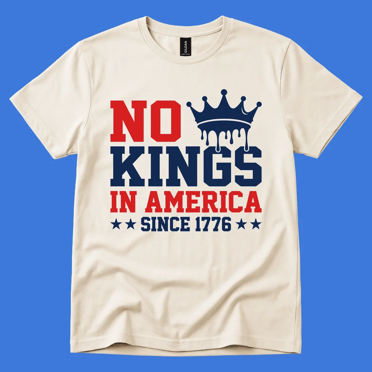 A patriotic design with text "NO KINGS IN AMERICA SINCE 1776" and a dripping blue crown, celebrating American independence.