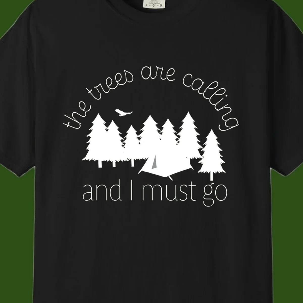 Minimalist camping design with evergreen trees, tent, and airplane with text 'The trees are calling and I must go'