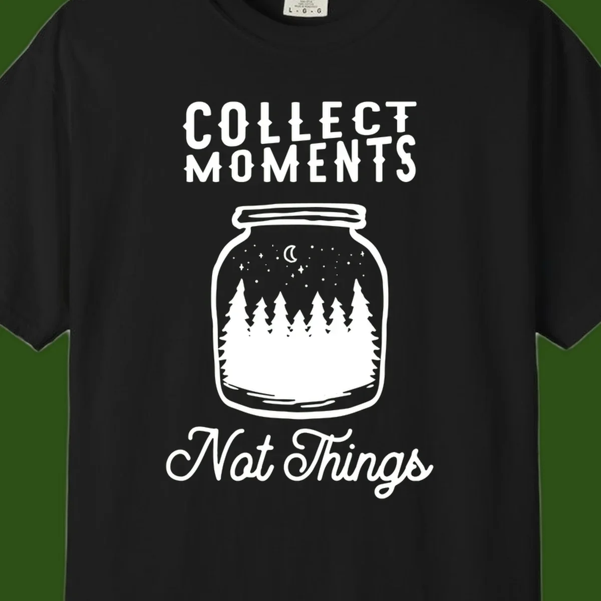 White illustrated mason jar filled with evergreen forest, moon, and stars with text 'Collect Moments Not Things' for camping enthusiasts