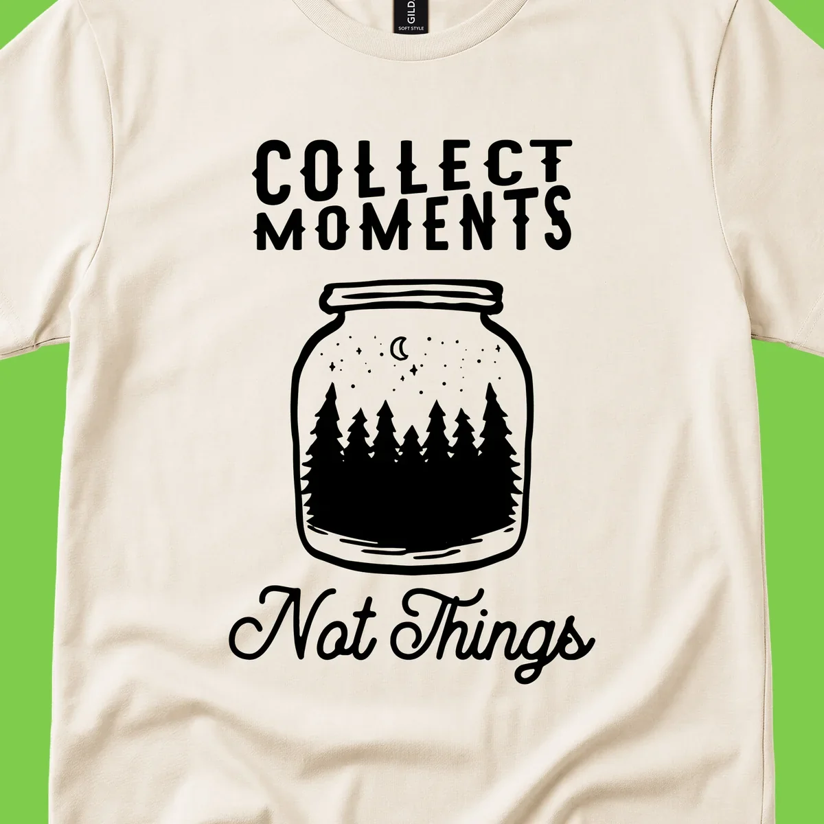 White illustrated mason jar filled with evergreen forest, moon, and stars with text 'Collect Moments Not Things' for camping enthusiasts