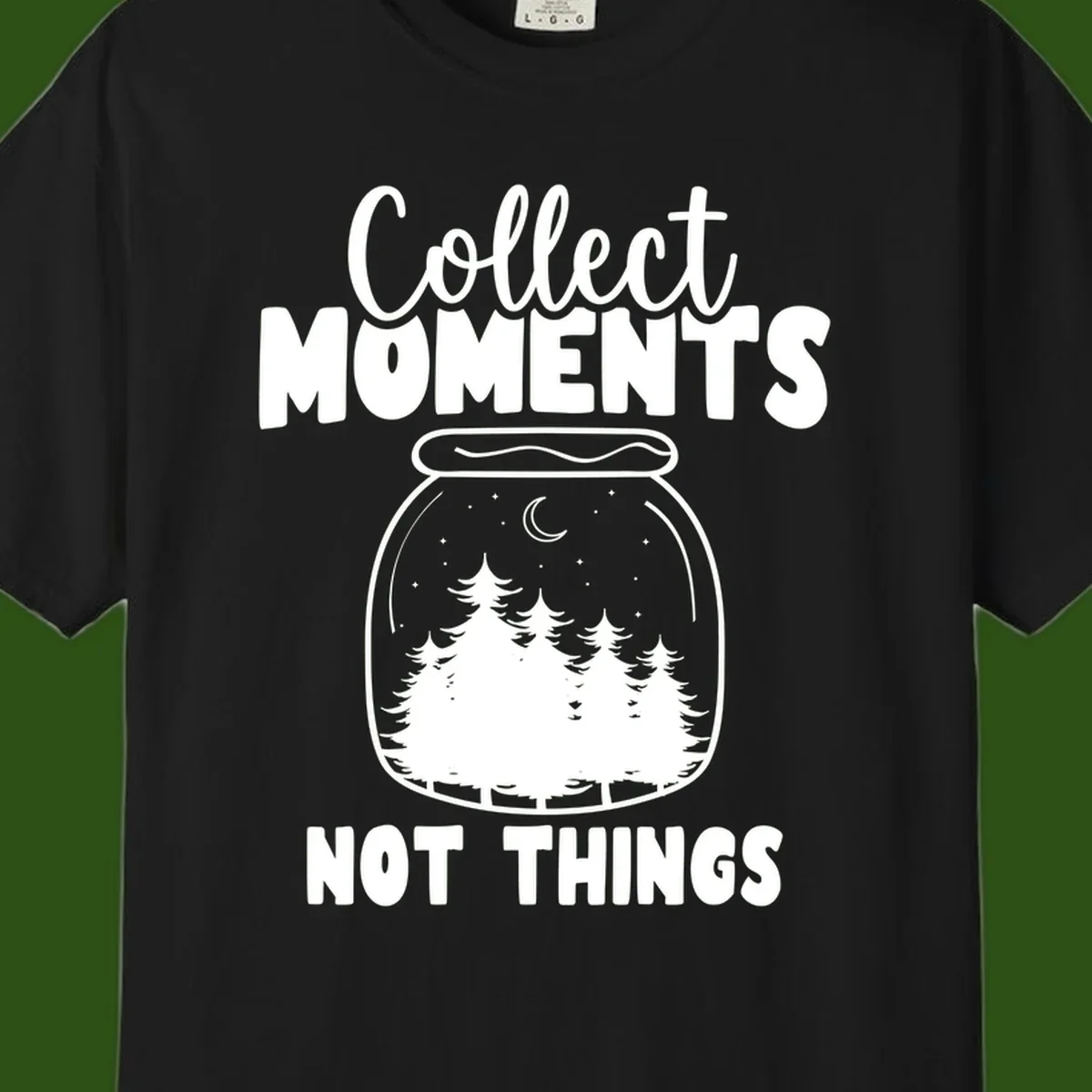 Illustration of a mason jar containing a nighttime forest scene with trees, moon, and stars, with text reading 'Collect Moments Not Things'
