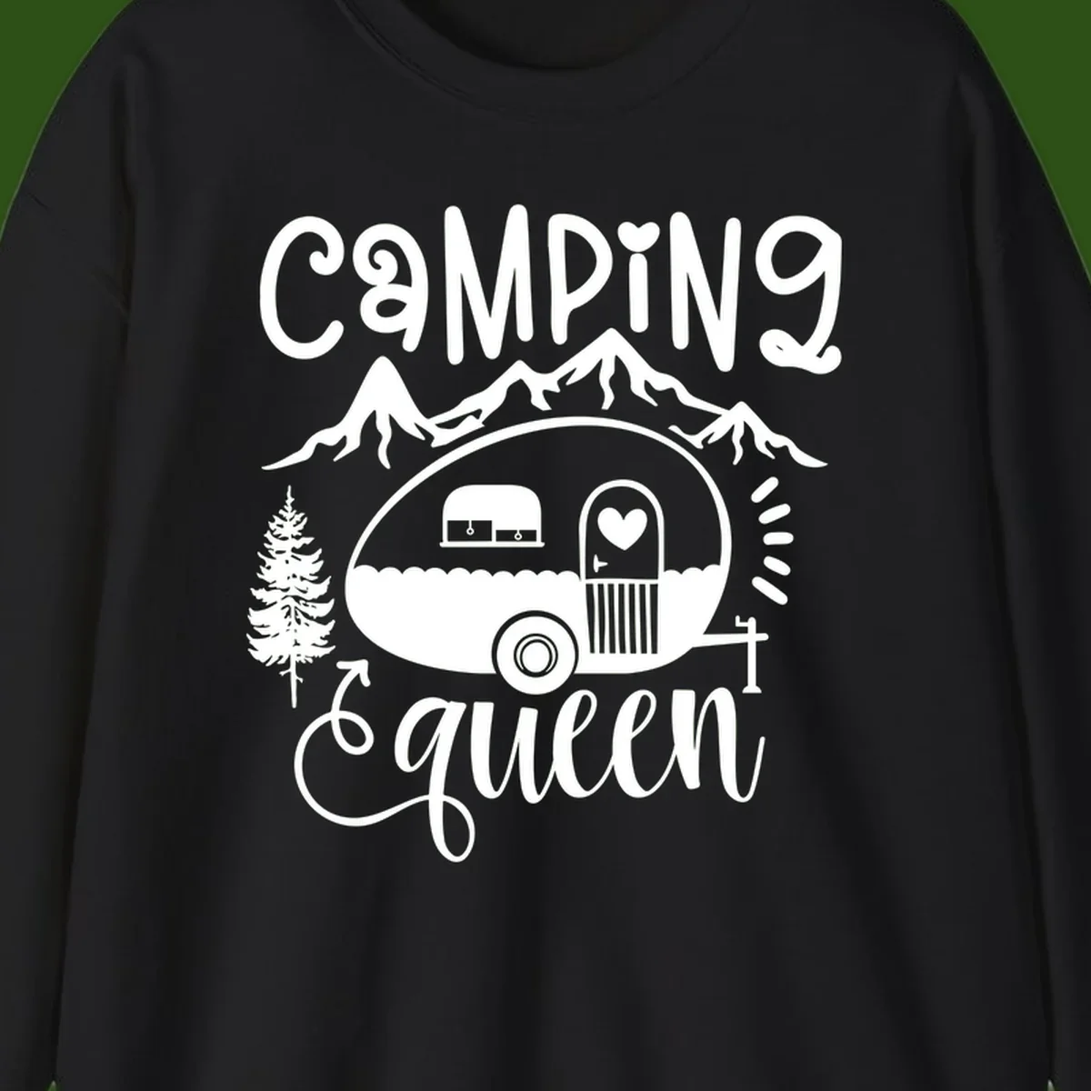 Retro illustration of a vintage Airstream trailer with a heart on the door, surrounded by mountains, trees, and campfire with 'Camping Queen' text