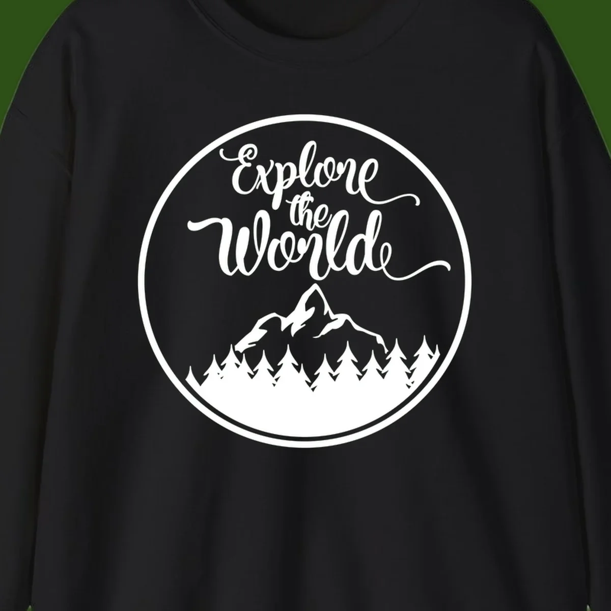 White circular badge with 'Explore the World' cursive text above mountain peak and evergreen forest silhouette on gray background