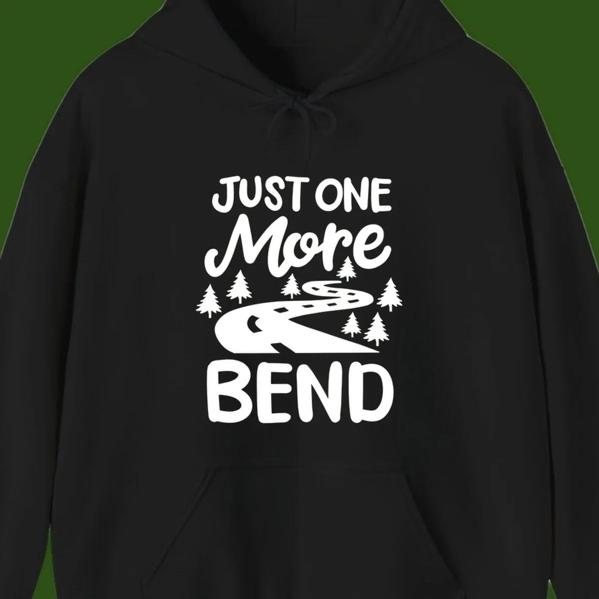 White design on gray background showing a winding road through evergreen trees with cursive text reading 'Just One More Bend'
