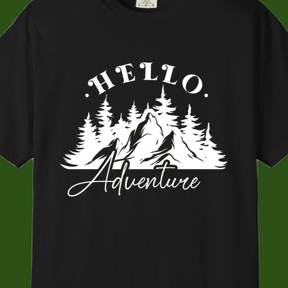 Hello adventure mountain design featuring snow-capped peak and evergreen forest silhouette in white and gray