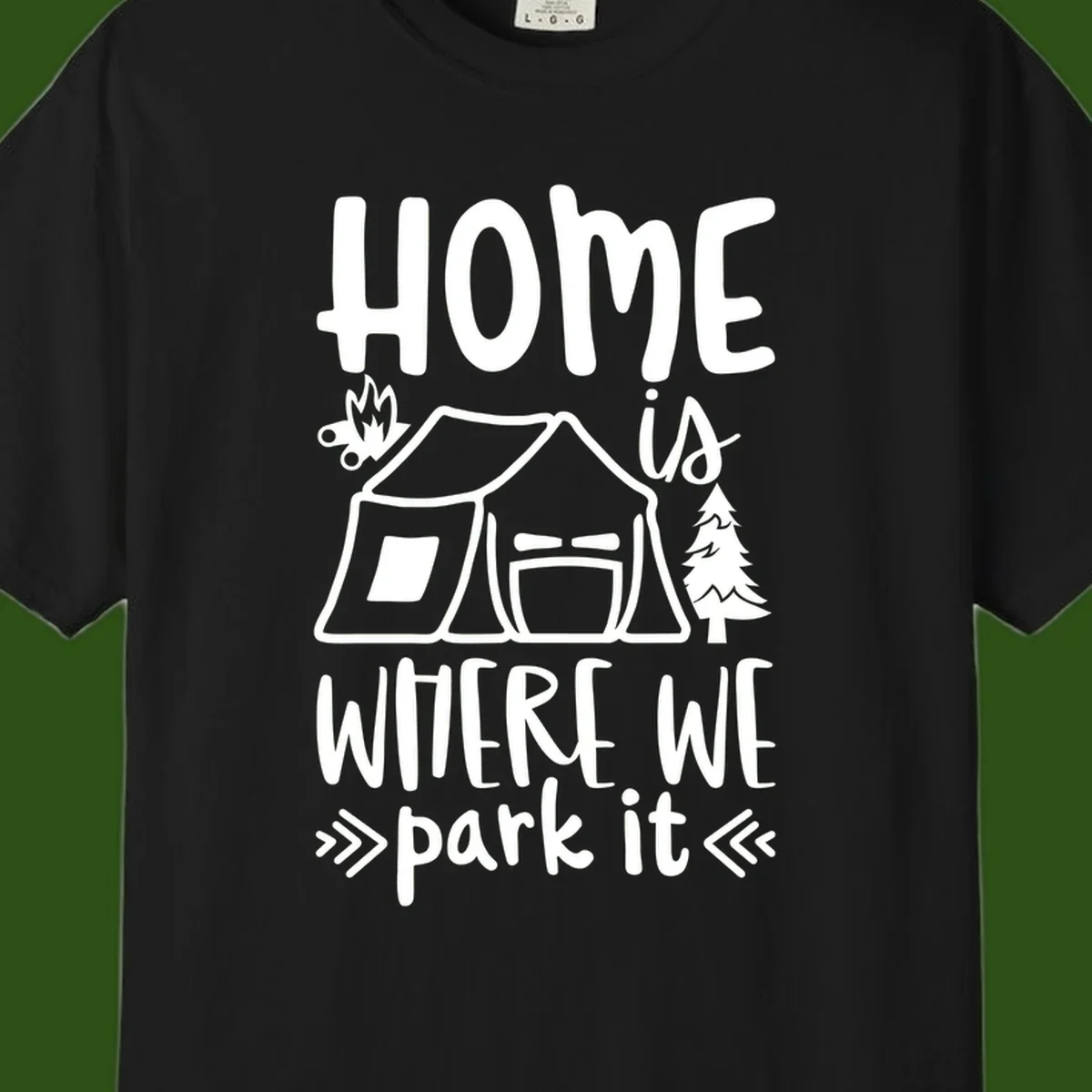 Home is where we park it camping design with tent, campfire, and evergreen tree illustration