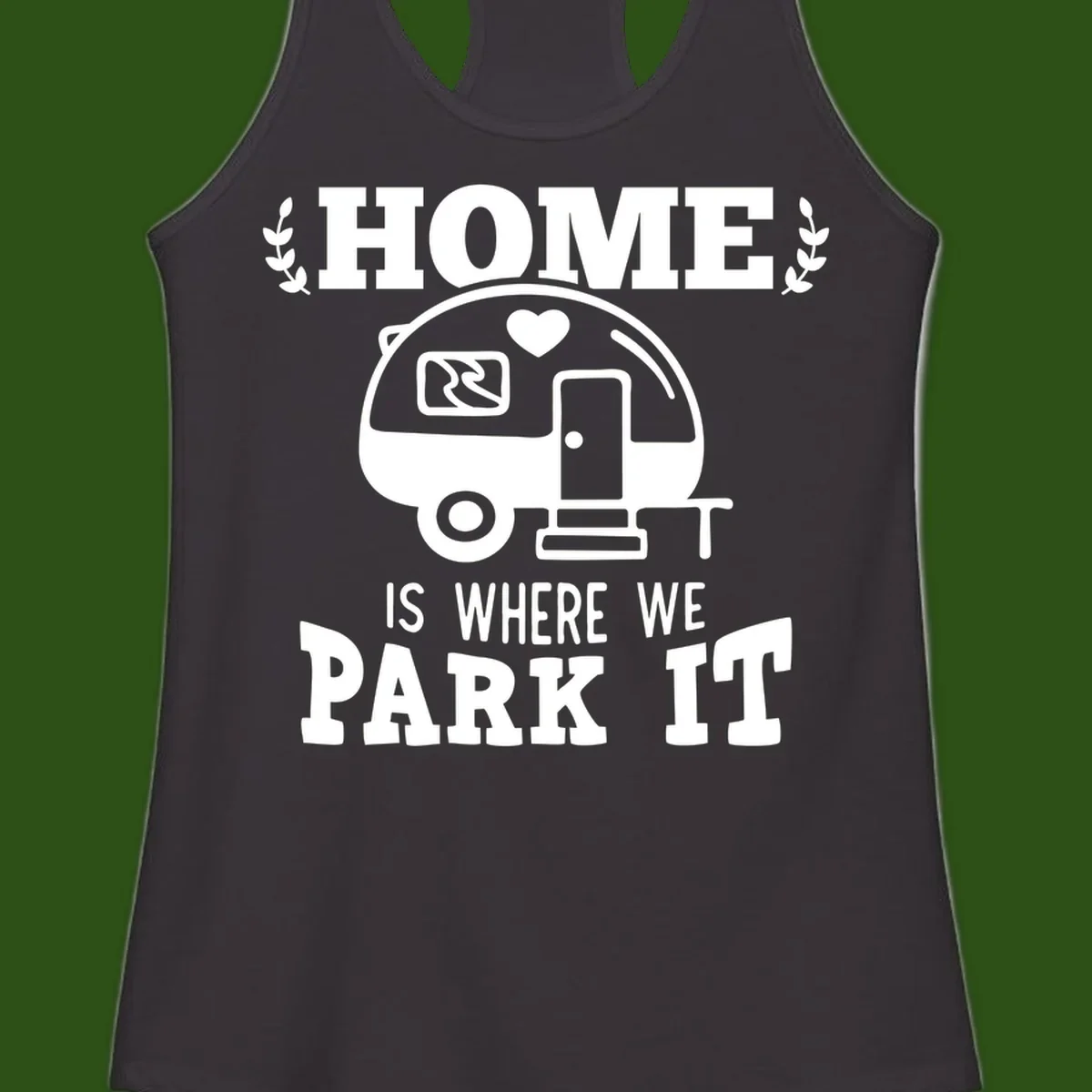 Vintage travel trailer illustration with 'Home Is Where We Park It' text and laurel wreaths on gray background
