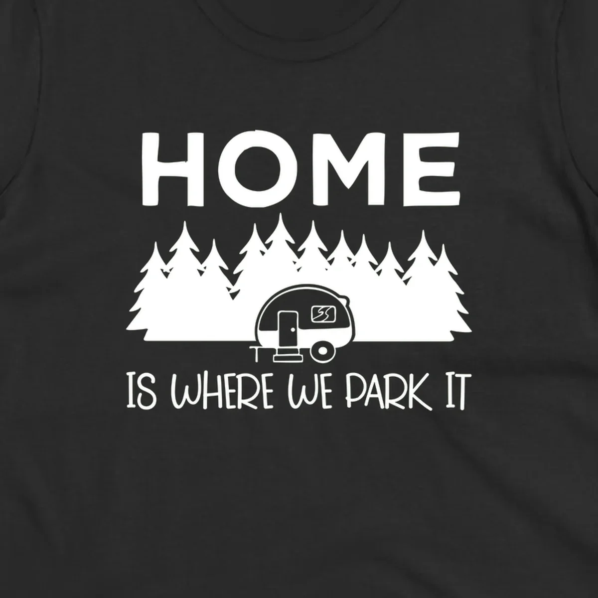 Home is where we park it design with travel trailer and forest trees on gray background