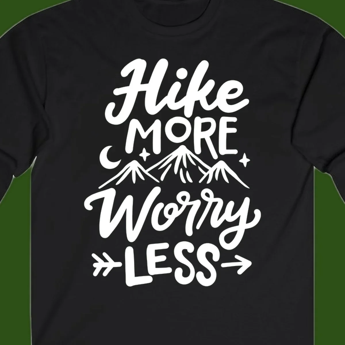 White lettered design reading 'Hike More Worry Less' with mountain peaks, moon, and stars on gray background
