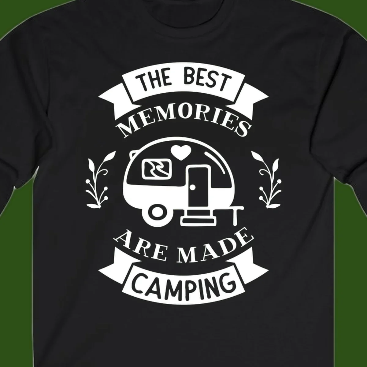 Vintage badge design with travel trailer and heart, text reading 'The Best Memories Are Made Camping' with decorative botanical branches