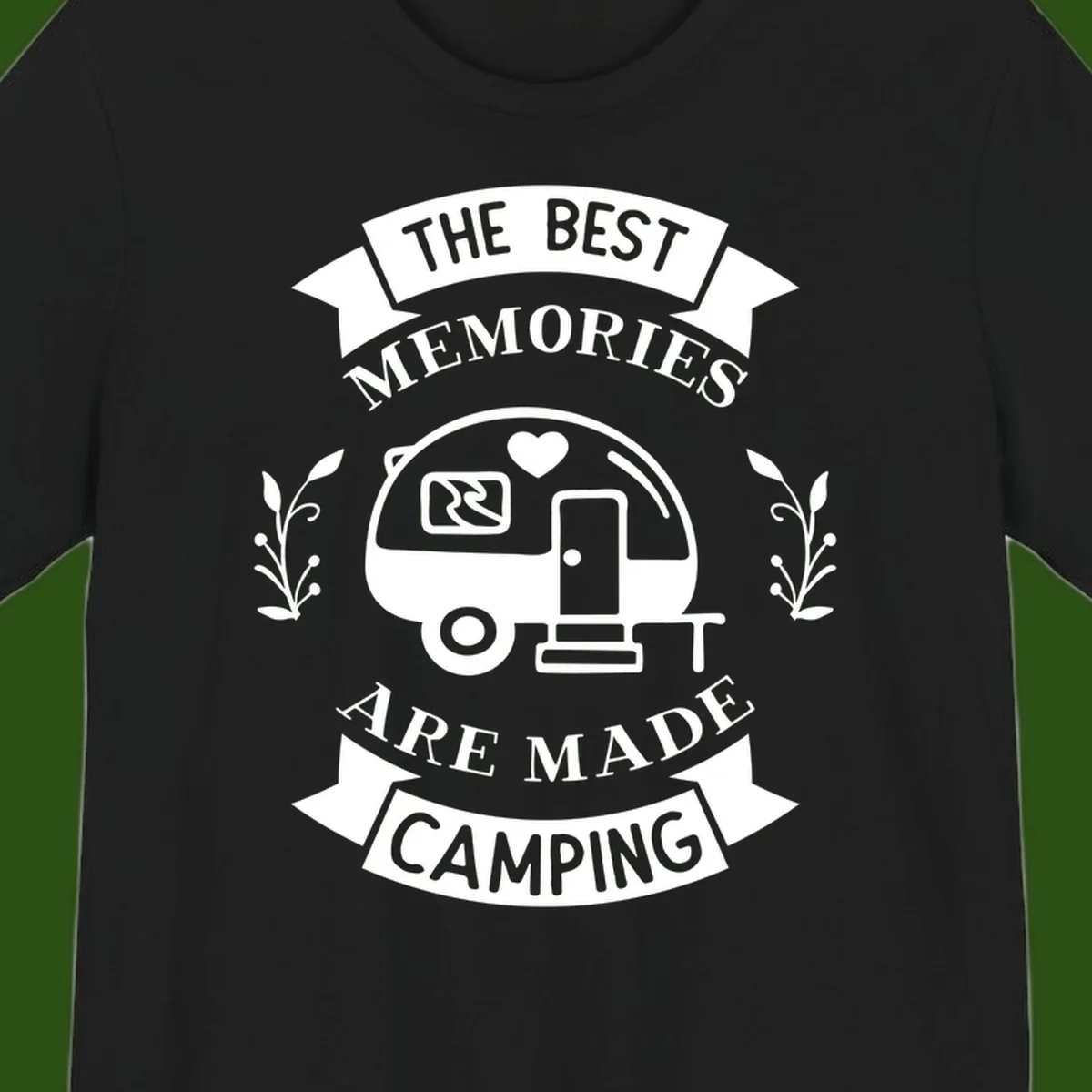 Vintage badge design with travel trailer and heart, text reading 'The Best Memories Are Made Camping' with decorative botanical branches