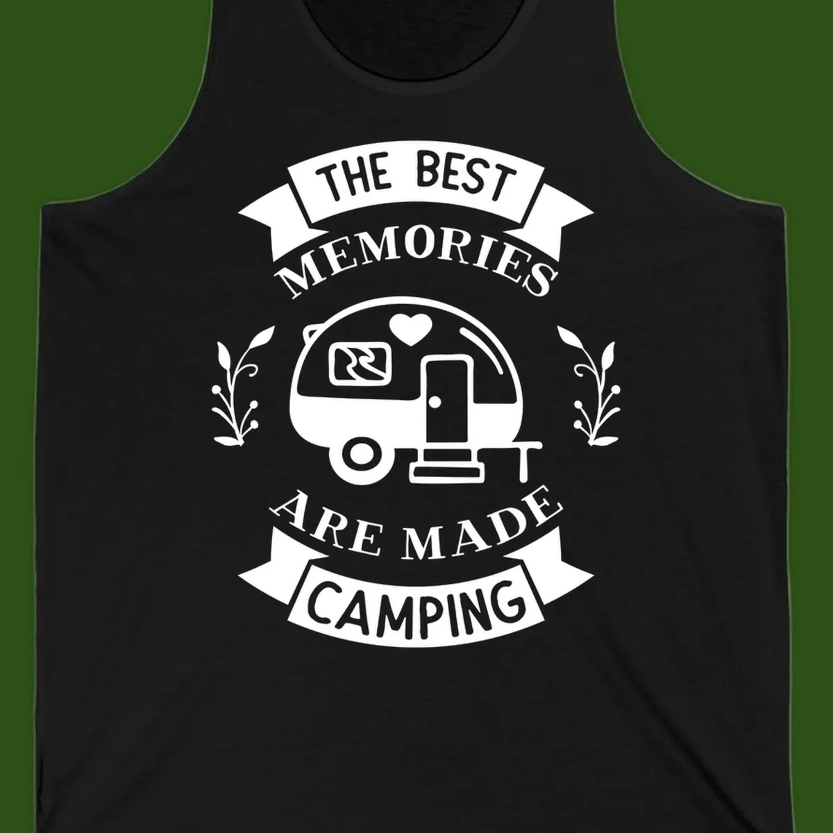 Vintage badge design with travel trailer and heart, text reading 'The Best Memories Are Made Camping' with decorative botanical branches