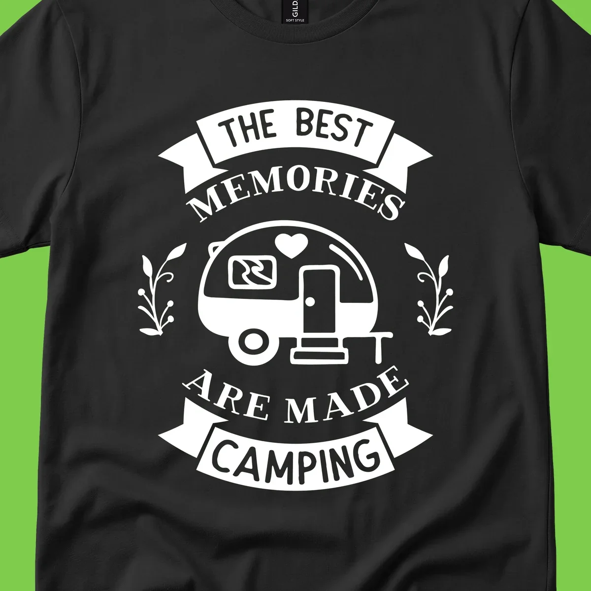 Vintage badge design with travel trailer and heart, text reading 'The Best Memories Are Made Camping' with decorative botanical branches