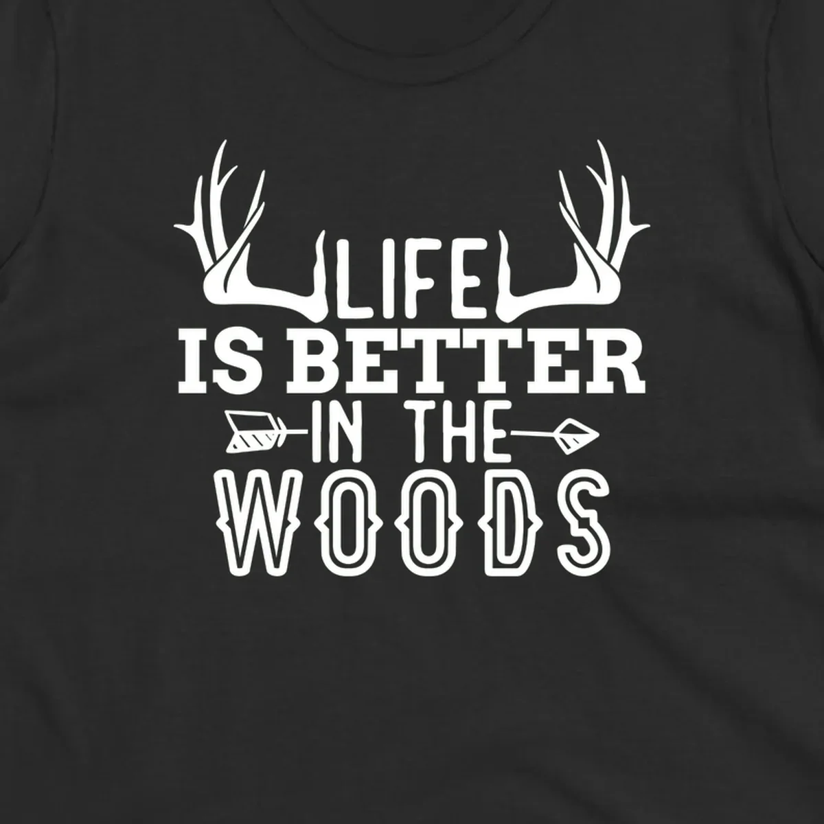 White text reading 'Life Is Better In The Woods' with deer antlers and arrows on gray background