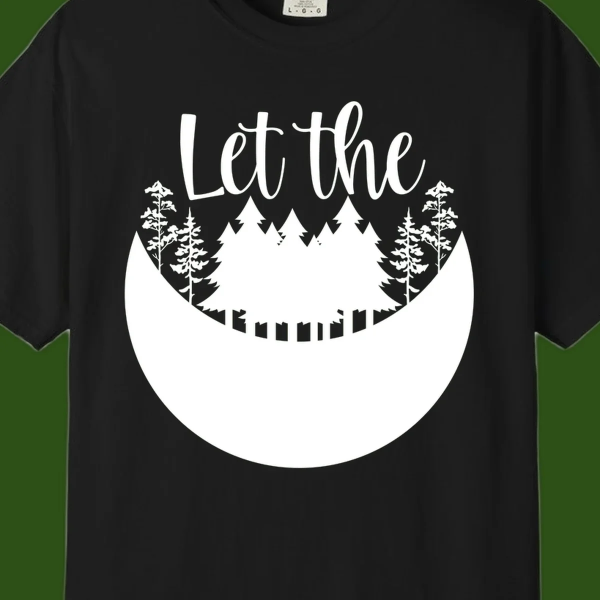 White silhouette of evergreen trees and mountain peaks arranged in a crescent moon shape with 'Let the' text above in script font on gray background.