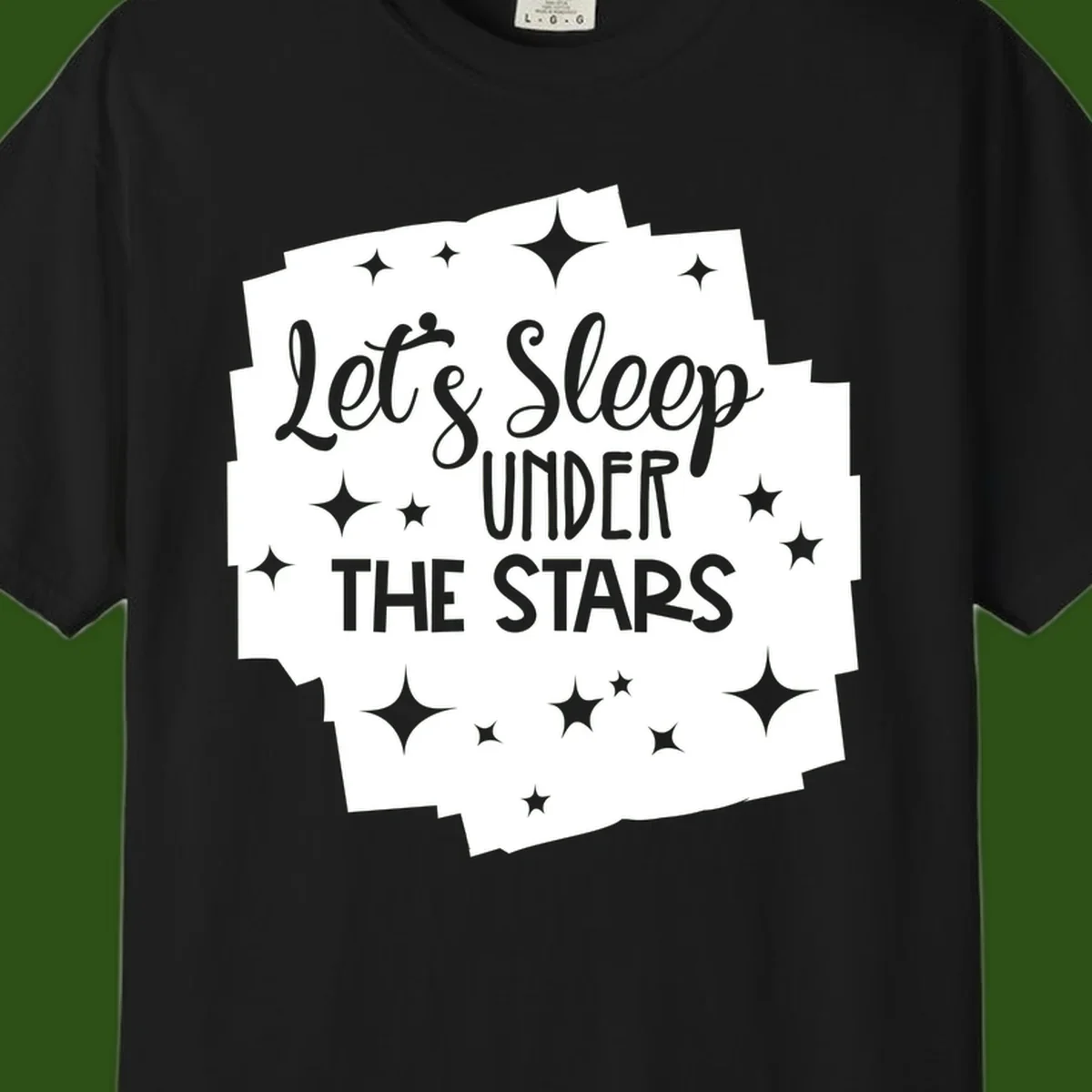 Whimsical design with 'Let's Sleep Under The Stars' text surrounded by sparkles and stars, evoking a cozy camping night.