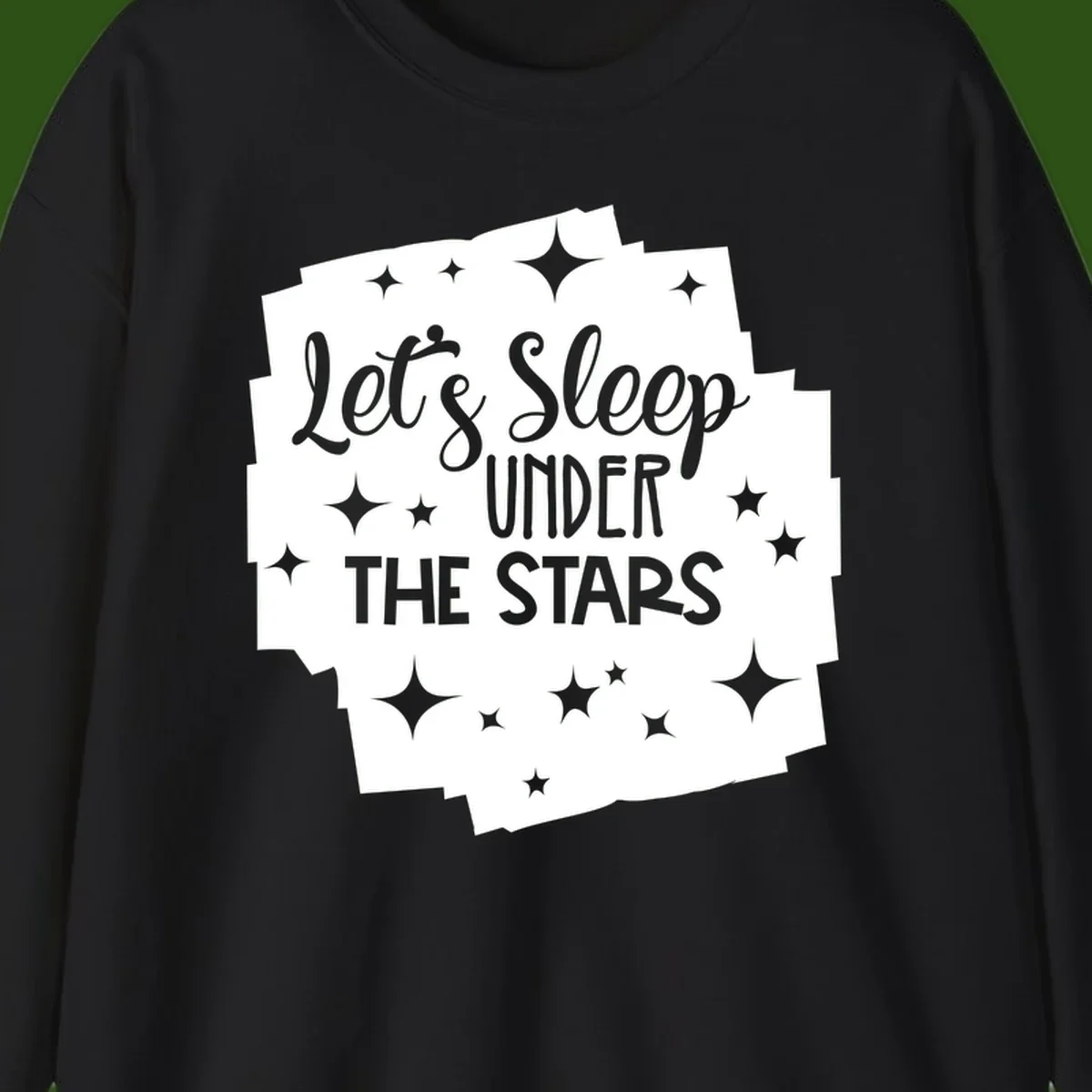 Whimsical design with 'Let's Sleep Under The Stars' text surrounded by sparkles and stars, evoking a cozy camping night.