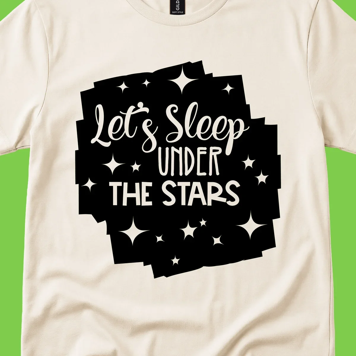Whimsical design with 'Let's Sleep Under The Stars' text surrounded by sparkles and stars, evoking a cozy camping night.
