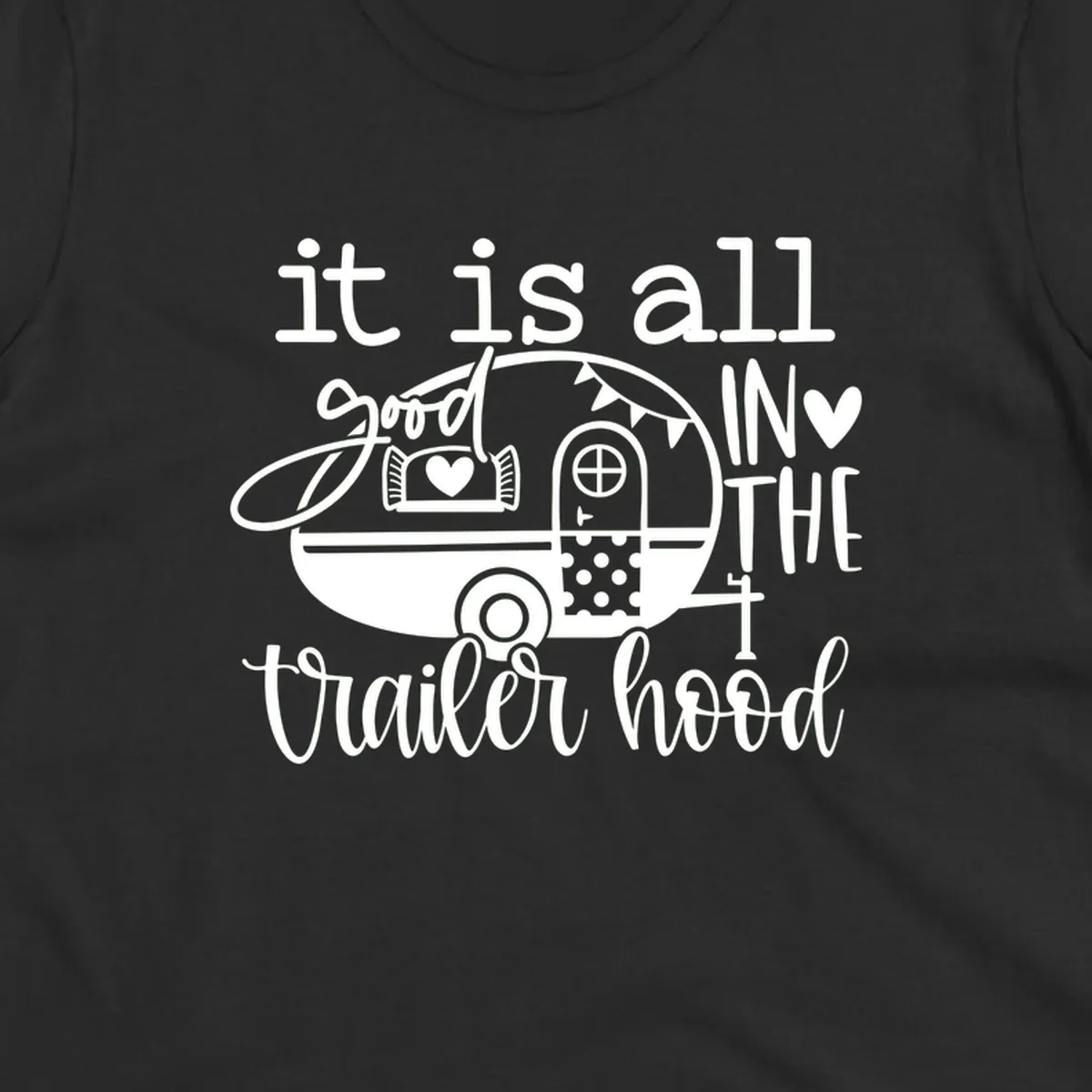 Vintage trailer illustration with decorative hearts and bunting, text reading 'it is all good in the trailer hood' in retro style