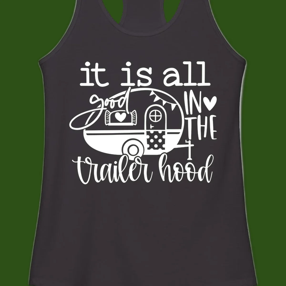 Vintage trailer illustration with decorative hearts and bunting, text reading 'it is all good in the trailer hood' in retro style
