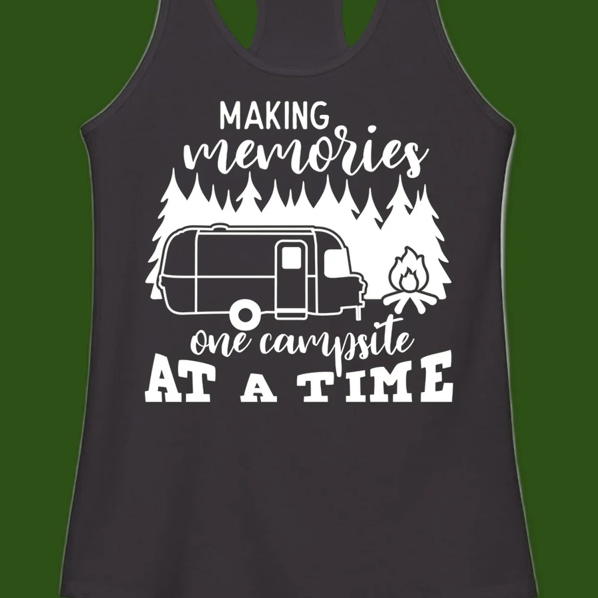 Vintage Airstream trailer parked among evergreen trees with a campfire, text reading Making Memories One Campsite At A Time