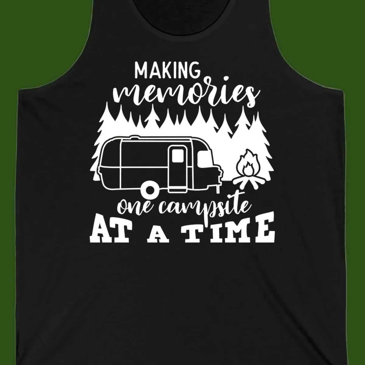 Vintage Airstream trailer parked among evergreen trees with a campfire, text reading Making Memories One Campsite At A Time